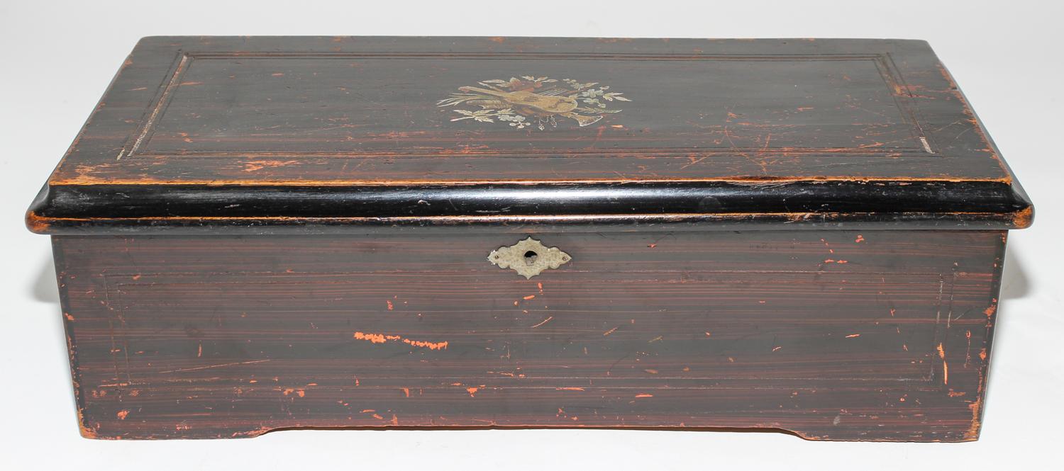 A Continental Cylinder Music Box. Height 6 x width 18 1/2 x depth 8 1/2 inches.