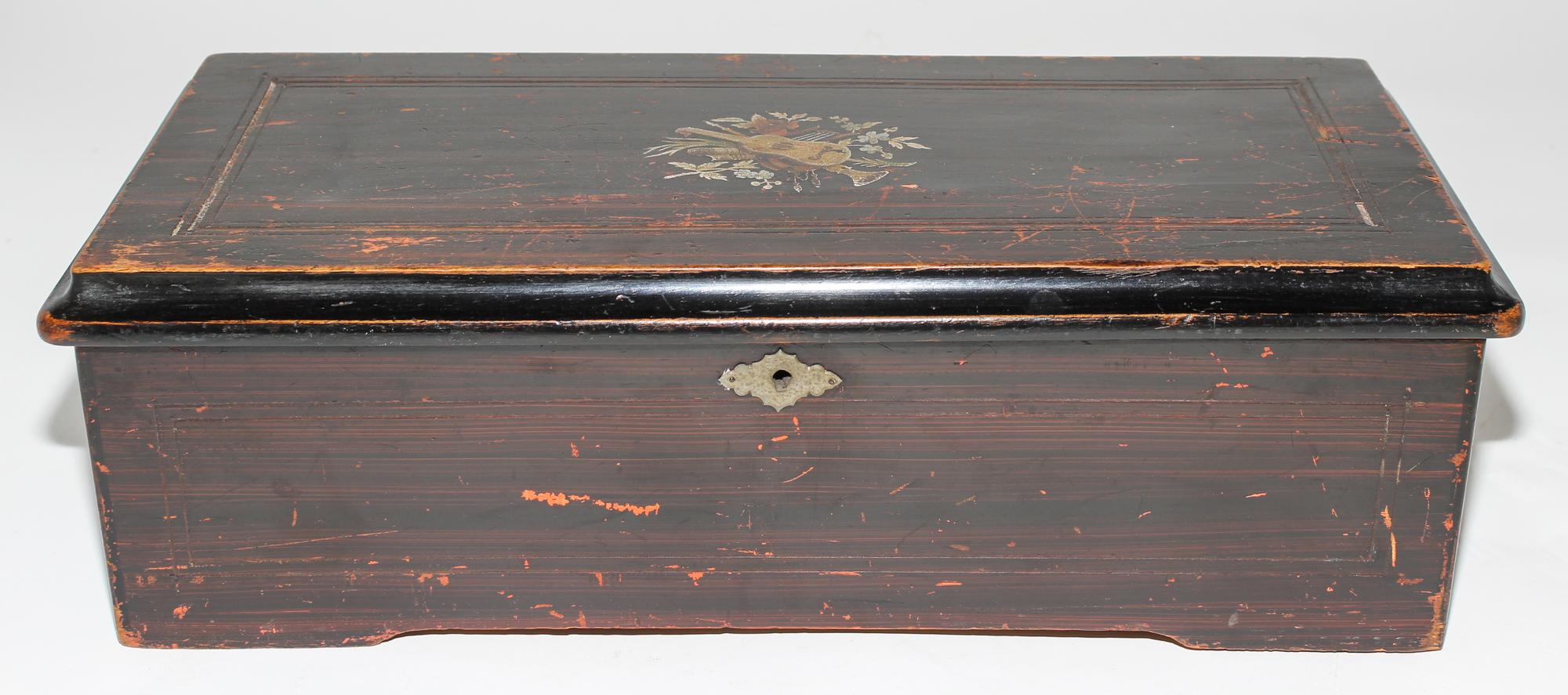 A Continental Cylinder Music Box. Height 6 x width 18 1/2 x depth 8 1/2 inches.