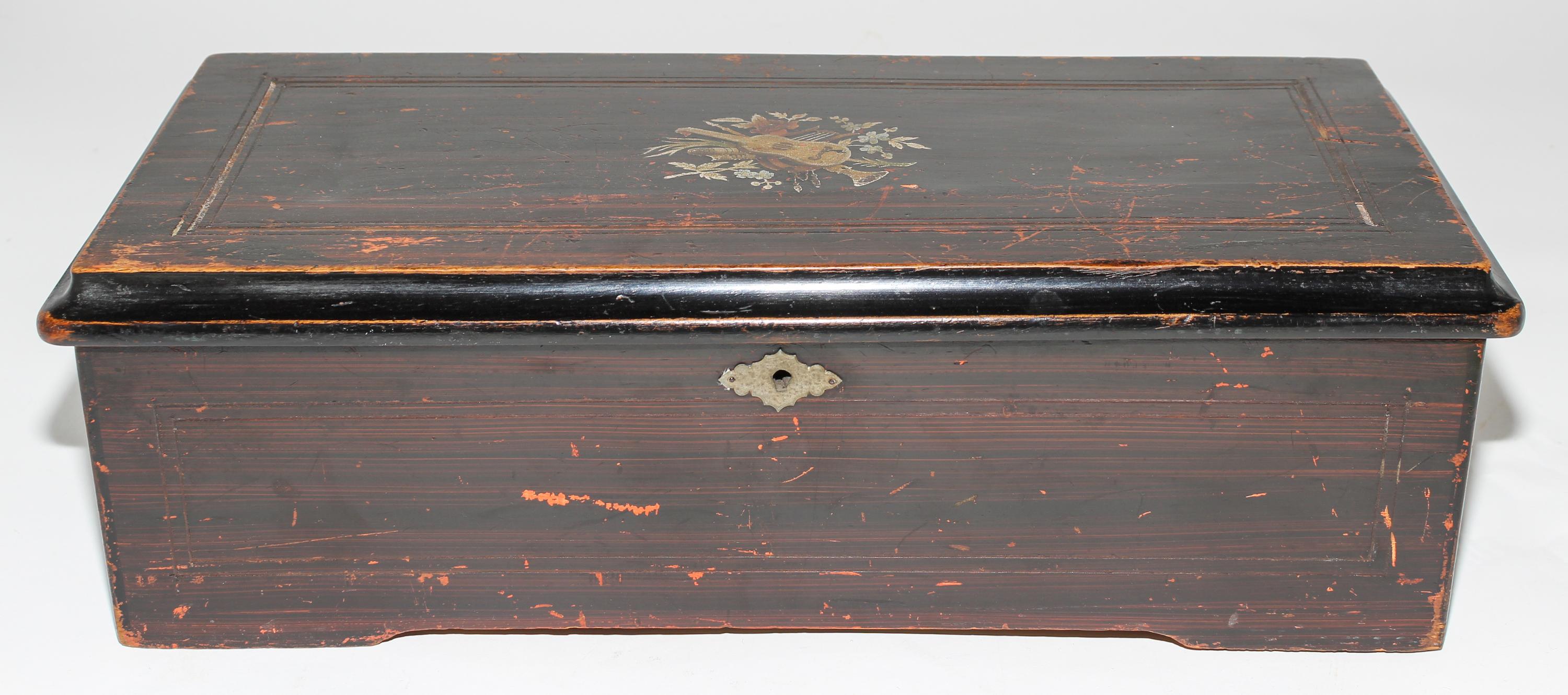 A Continental Cylinder Music Box. Height 6 x width 18 1/2 x depth 8 1/2 inches.