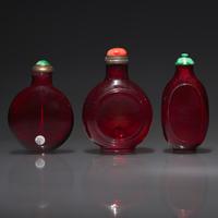 Three Chinese Ruby Glass Snuff Bottles, 18th Century and Later — 清中期及以後 寶石紅料鼻煙壺三支