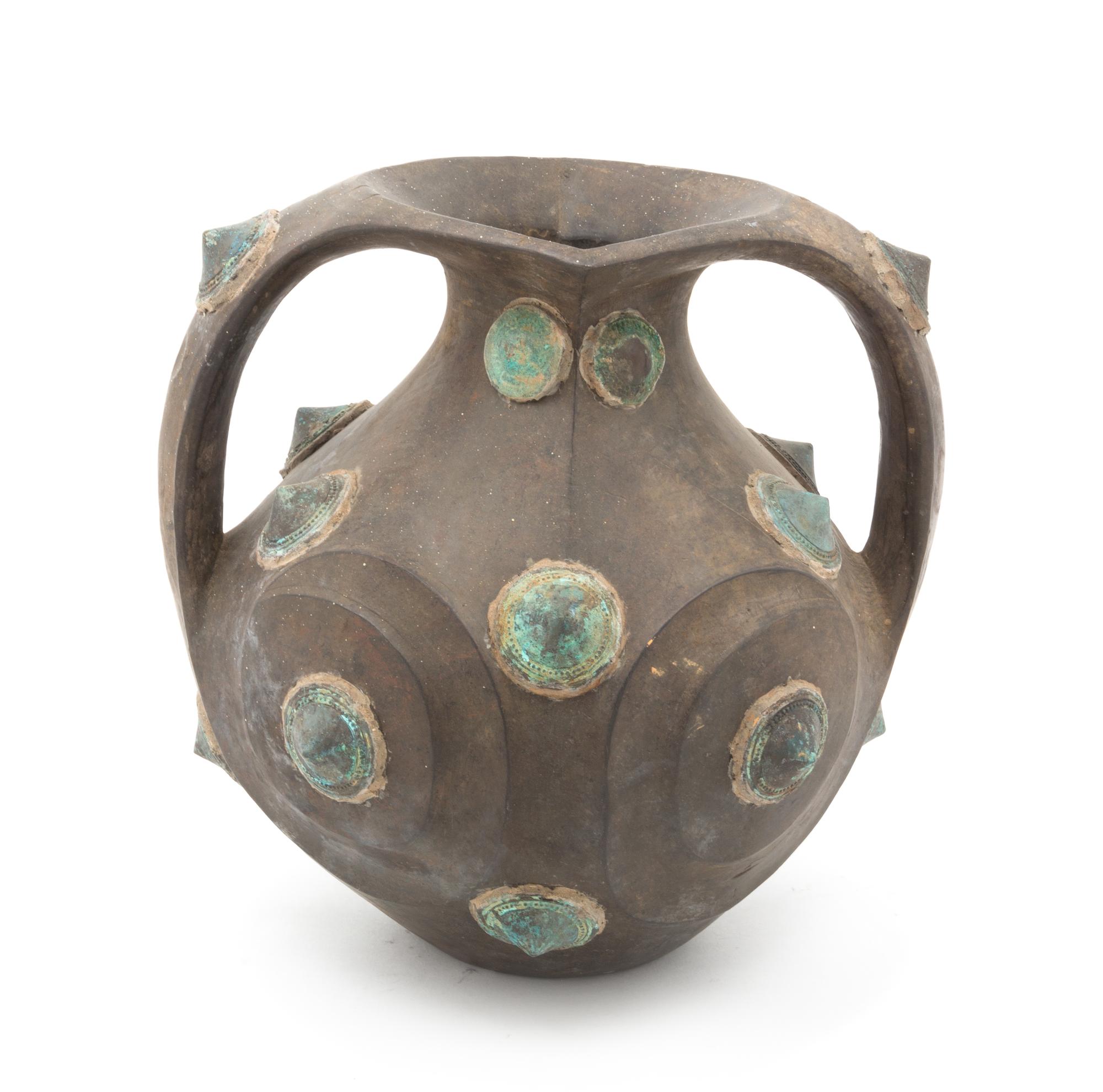 An Ethnographic Wood and Cast Metal Vessel Height 12 inches.