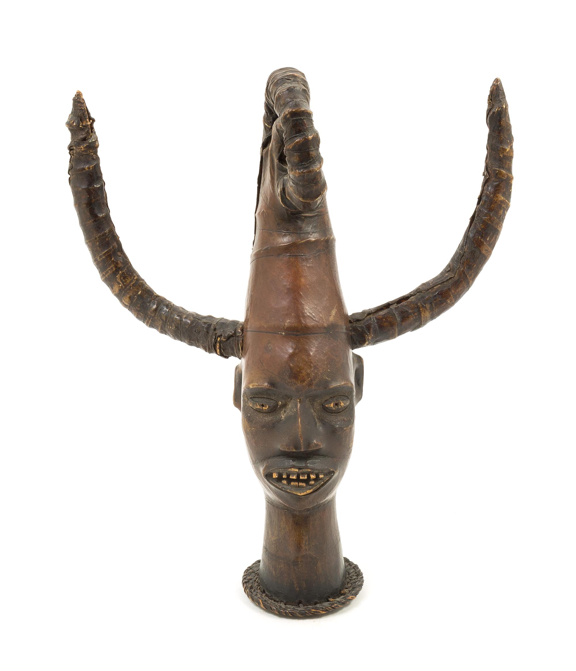 An Ekoi Head with Horns Height 15 1/2 inches. — 20TH CENTURY