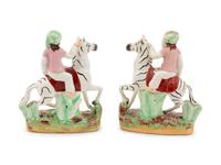 A Pair of Staffordshire Style Figural Groups