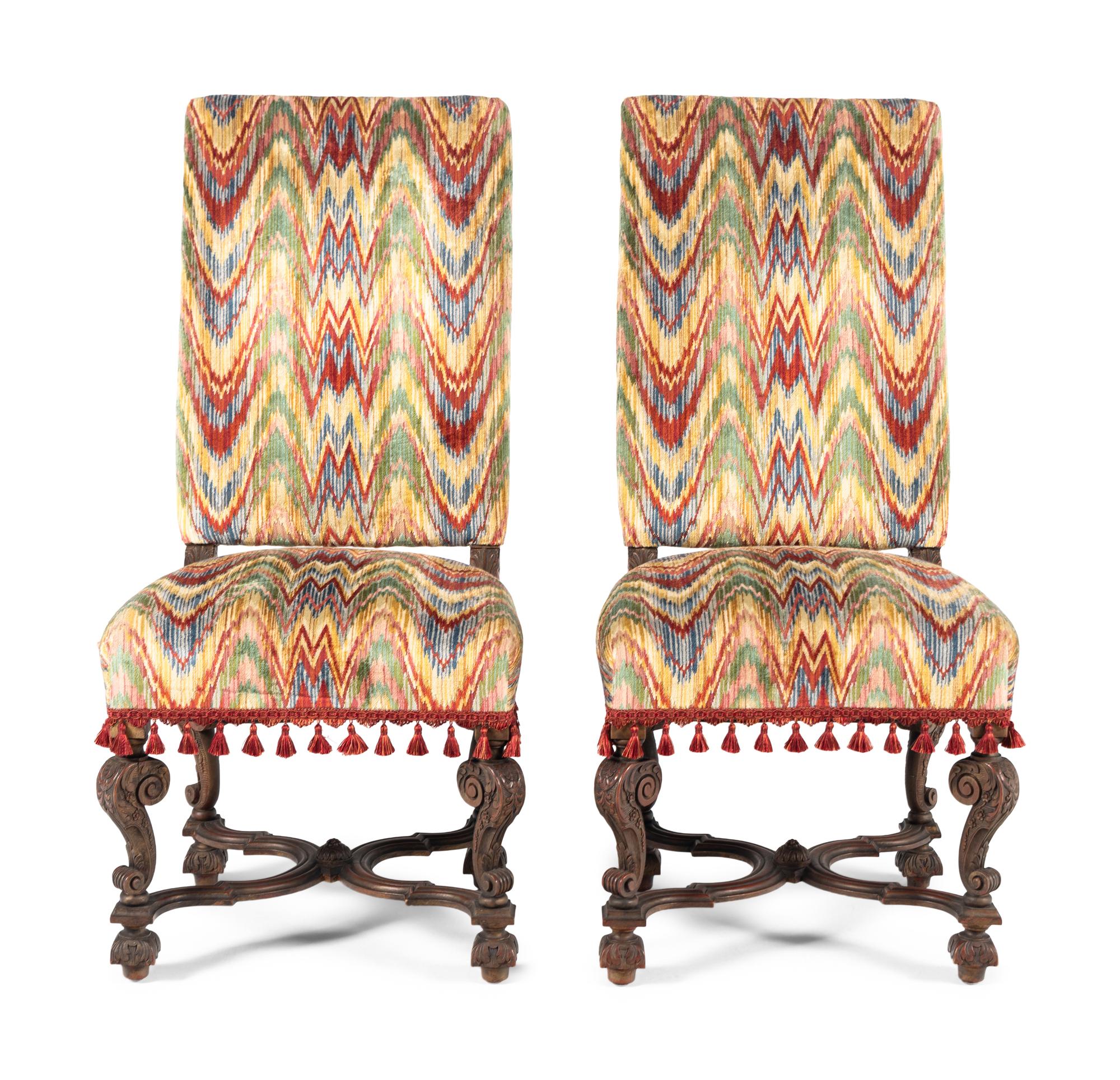 A Pair of William and Mary Style Carved Walnut Side Chairs