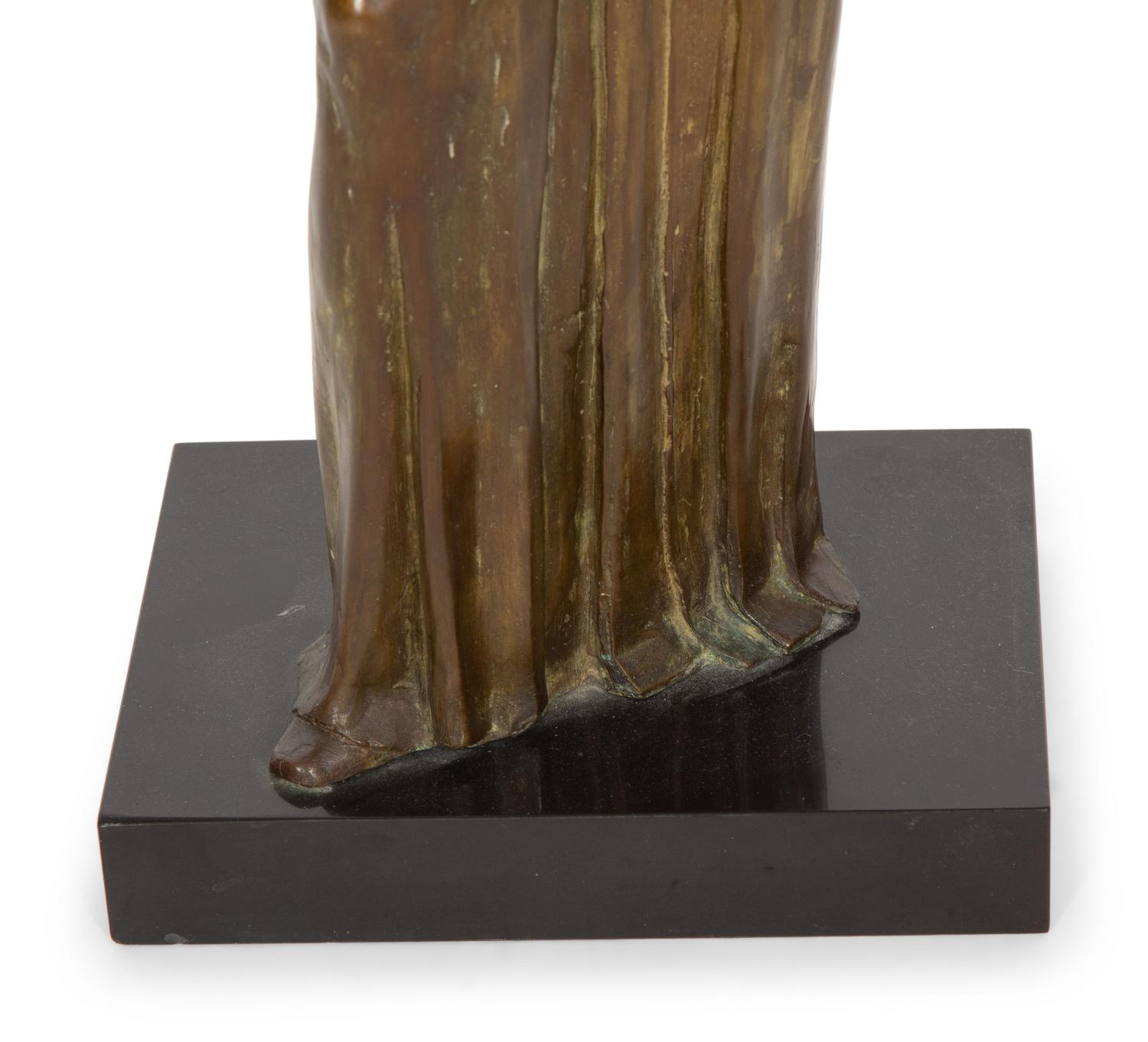 A Bronze Sculpture of a Standing Woman