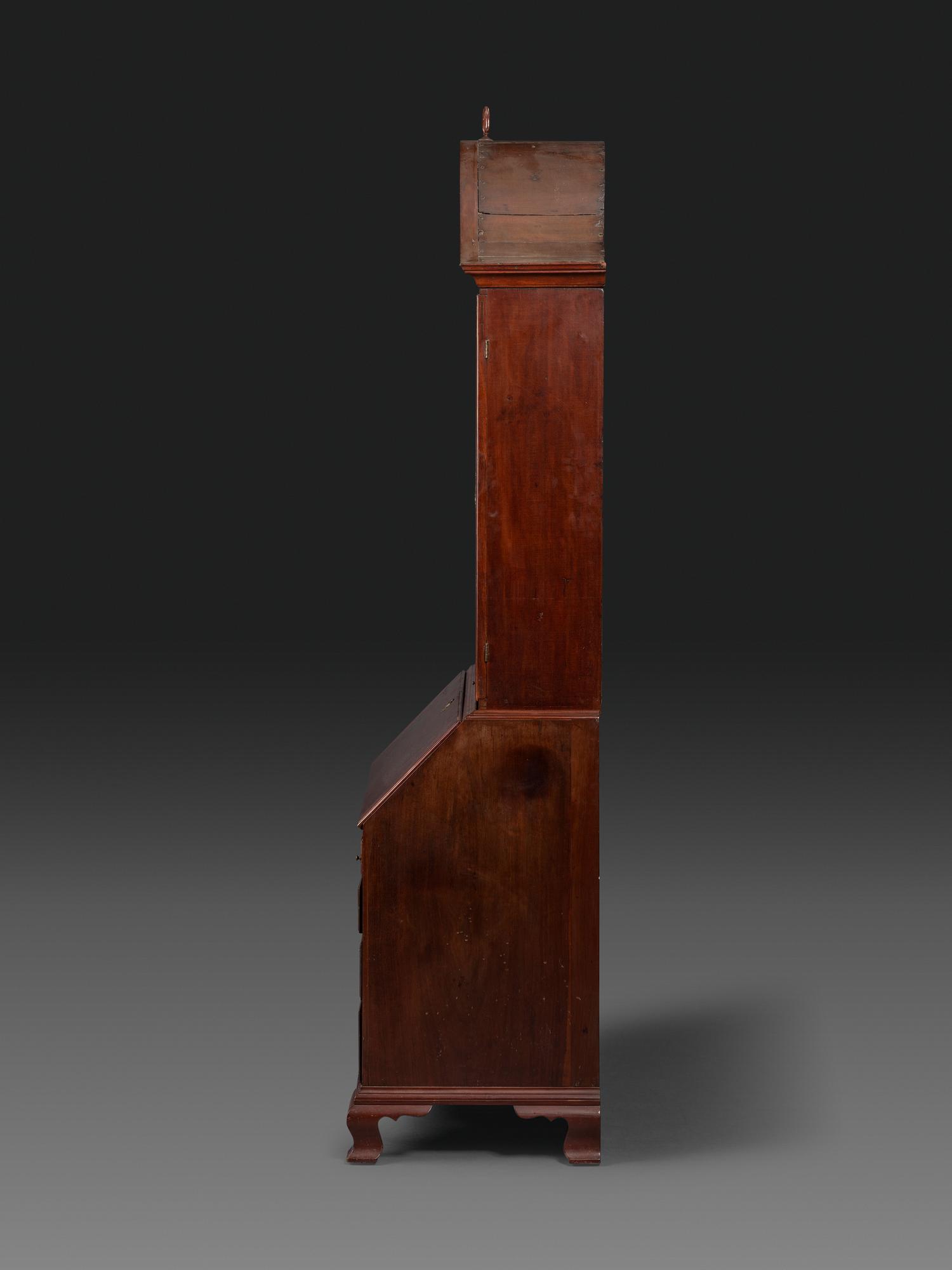 A Chippendale Figured Mahogany Bonnet Top Desk-and-Bookcase