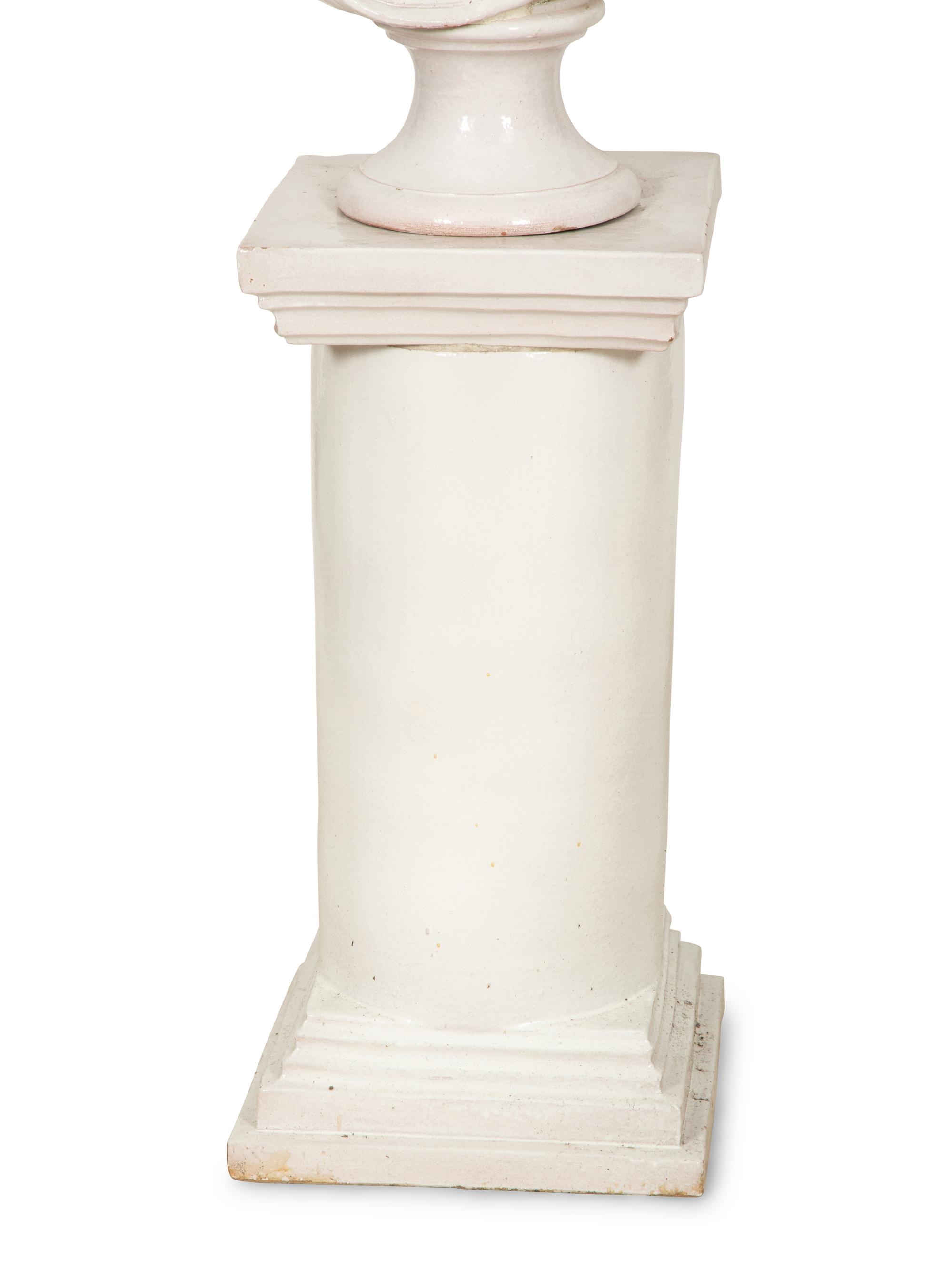 A Pair of Italian White Glazed Ceramic Busts on Pedestal Bases