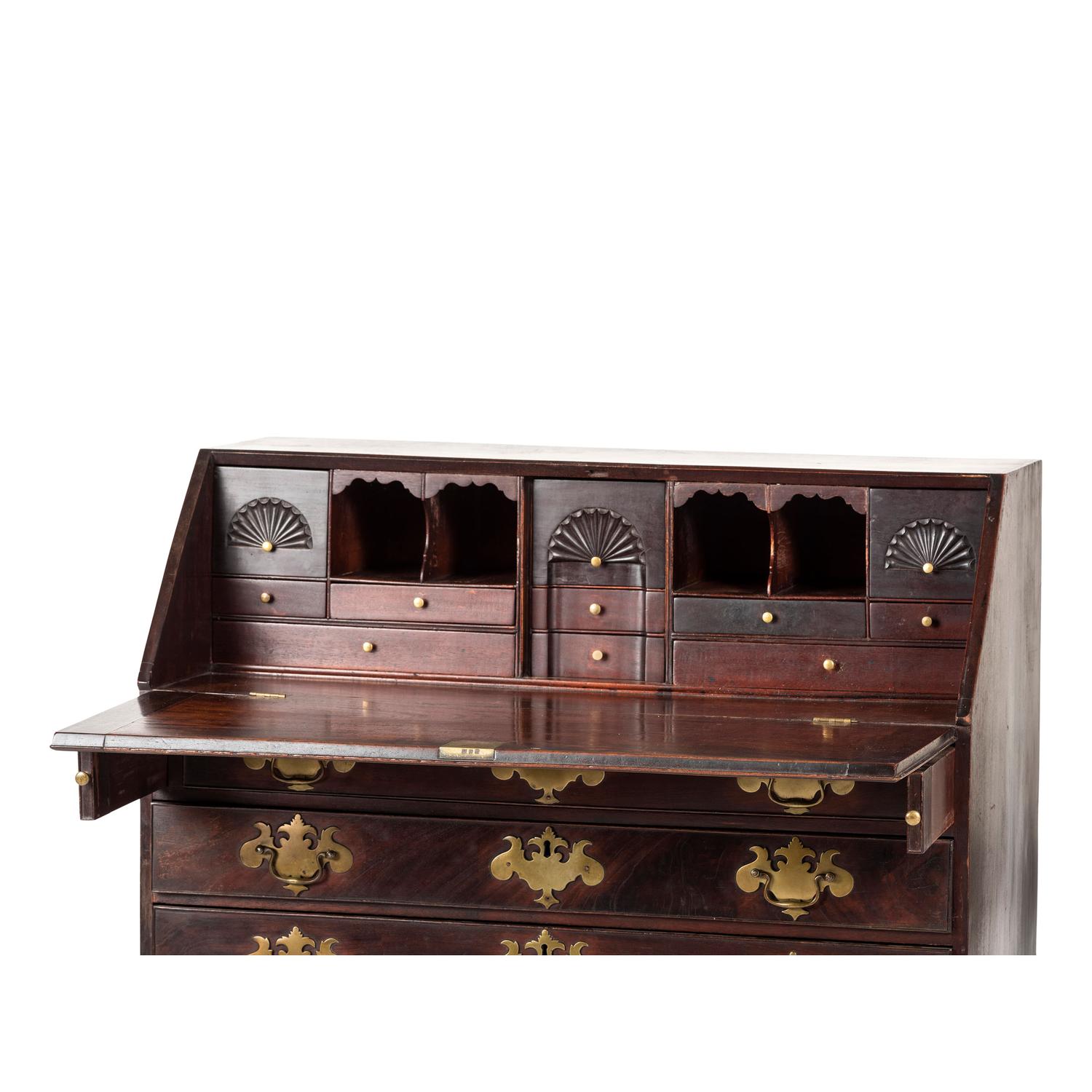 A Chippendale Carved and Figured Mahogany Slant-Front Desk