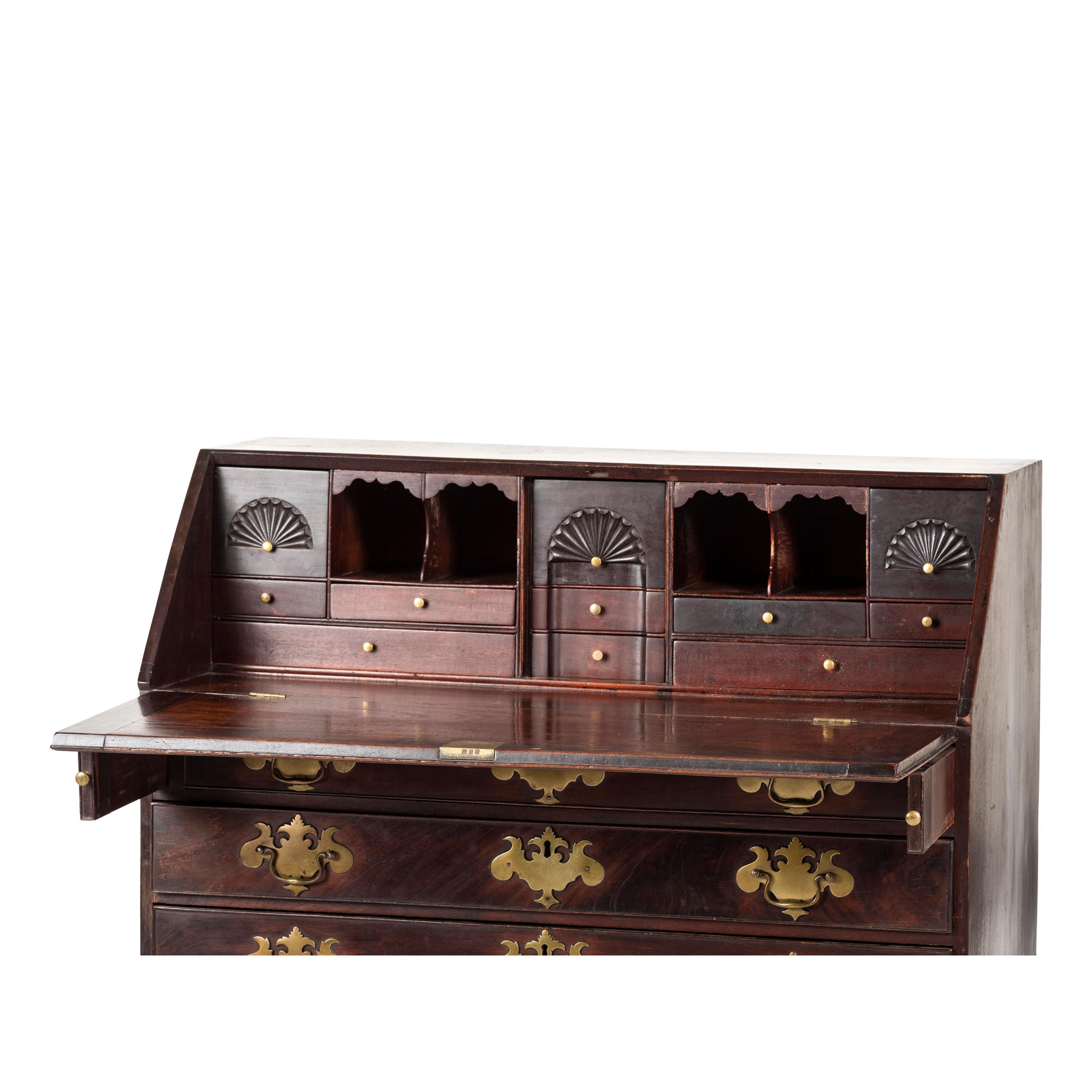 A Chippendale Carved and Figured Mahogany Slant-Front Desk