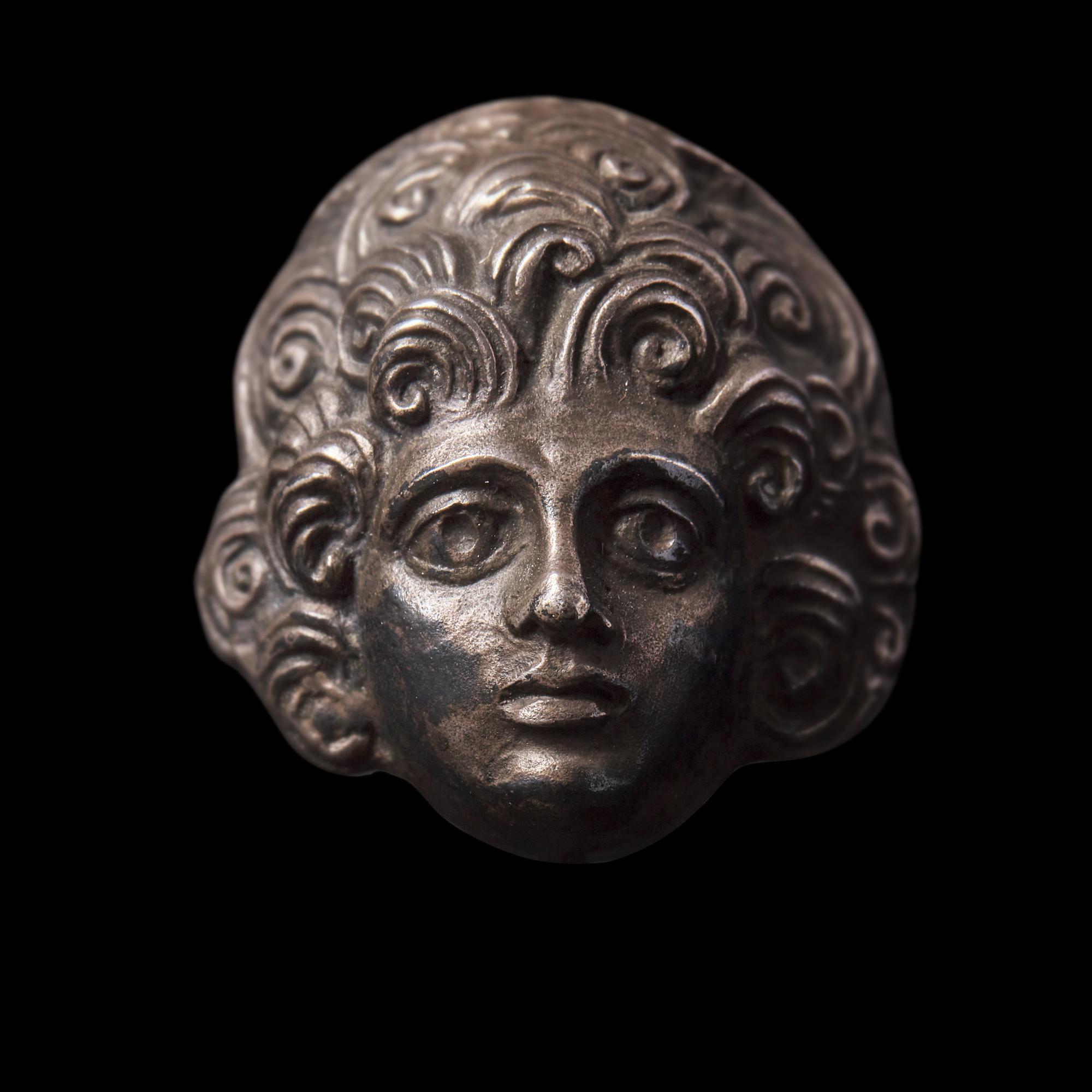 A Roman Silver Head and Two Roman Bronze Coins