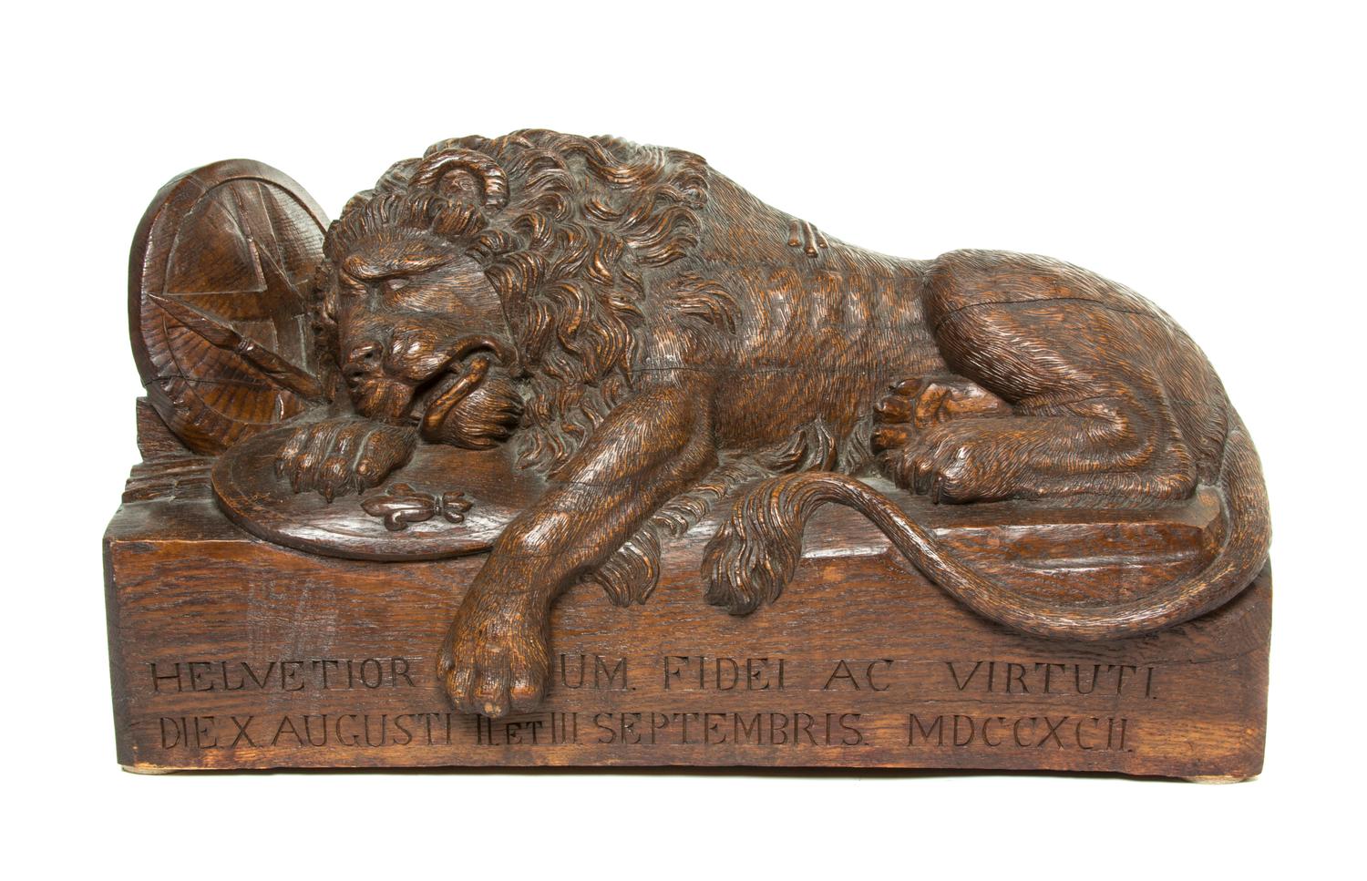A Carved Wood Model of the Lion of Lucerne, Width 24 1/4 inches.