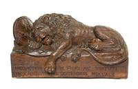 A Carved Wood Model of the Lion of Lucerne, Width 24 1/4 inches.