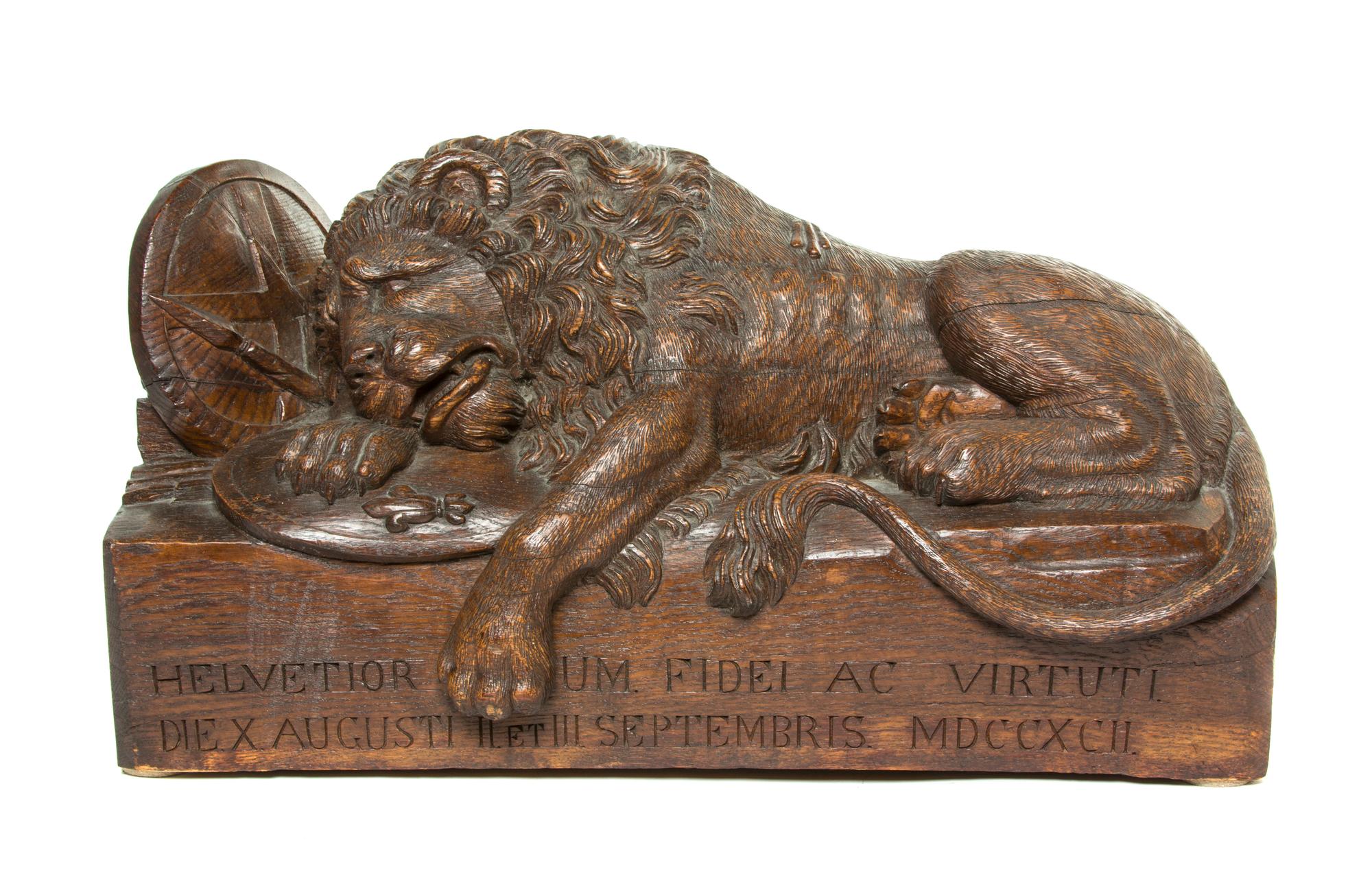 A Carved Wood Model of the Lion of Lucerne, Width 24 1/4 inches.