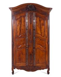 A Louis XV Provincial Carved Walnut Armoire