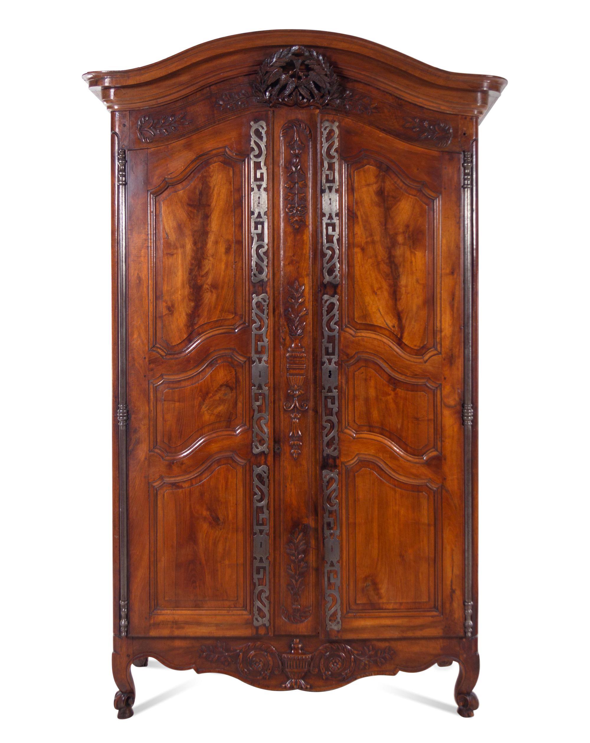 A Louis XV Provincial Carved Walnut Armoire
