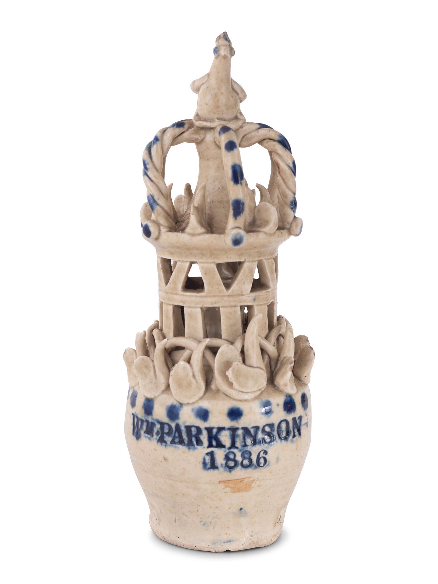 A Pair of Cobalt Decorated Stoneware Puzzle Banks