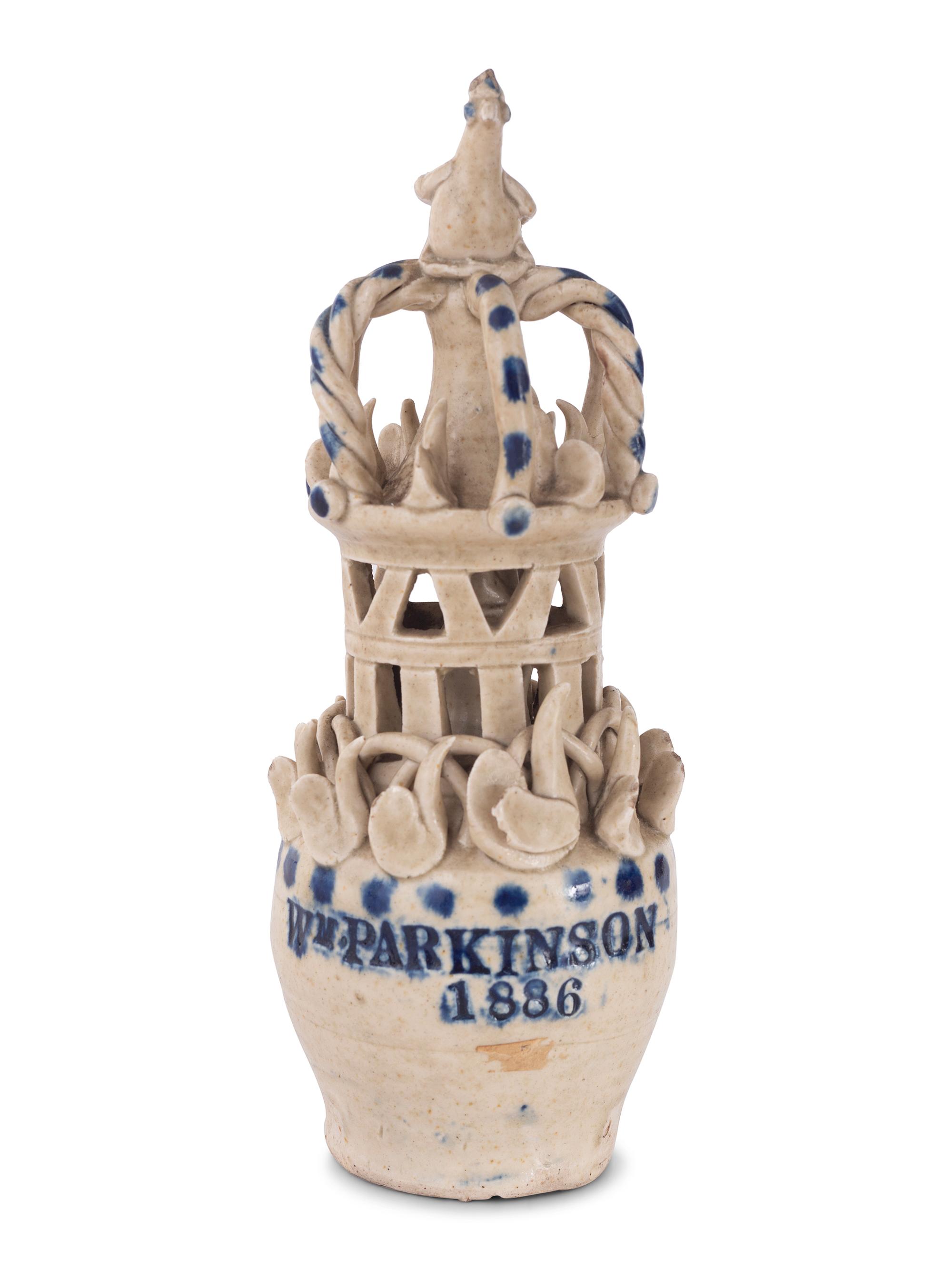 A Pair of Cobalt Decorated Stoneware Puzzle Banks