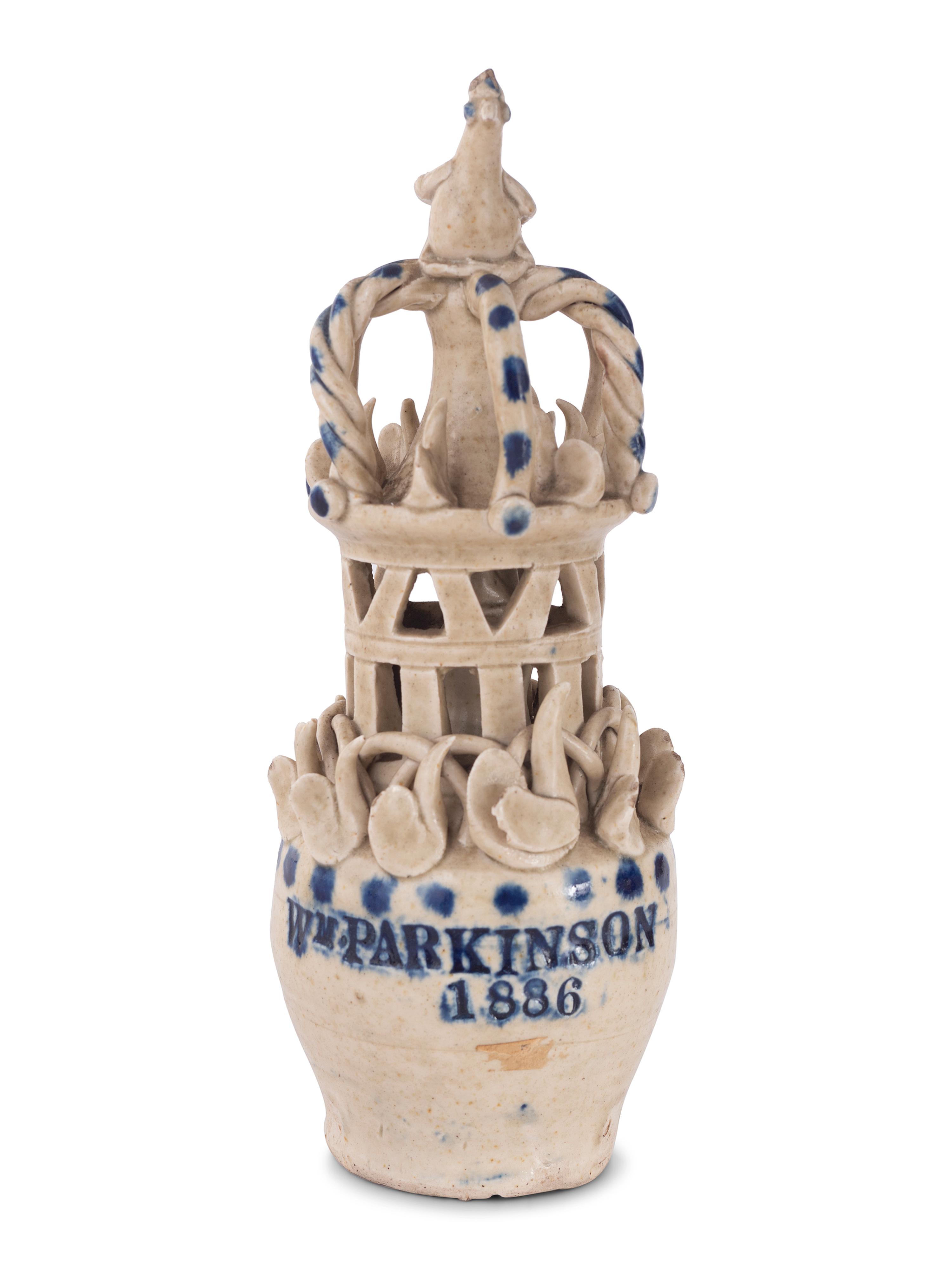 A Pair of Cobalt Decorated Stoneware Puzzle Banks
