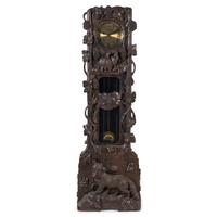 A Swiss Black Forest Carved Tall Case Clock