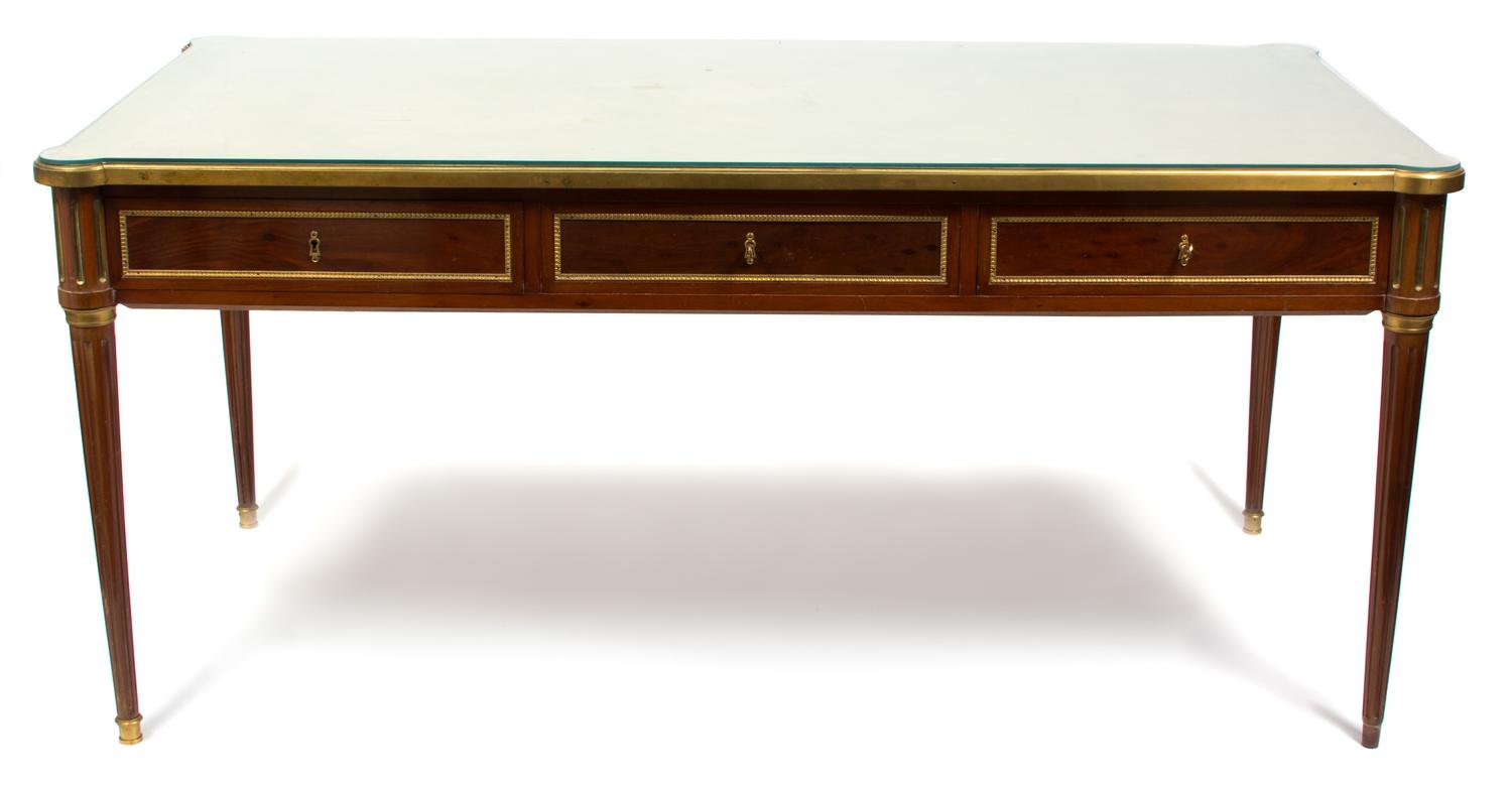 A Louis XVI Style Mahogany and Brass Mounted Library Table Height 31 x width 65 x depth 38 inches. — 19TH CENTURY