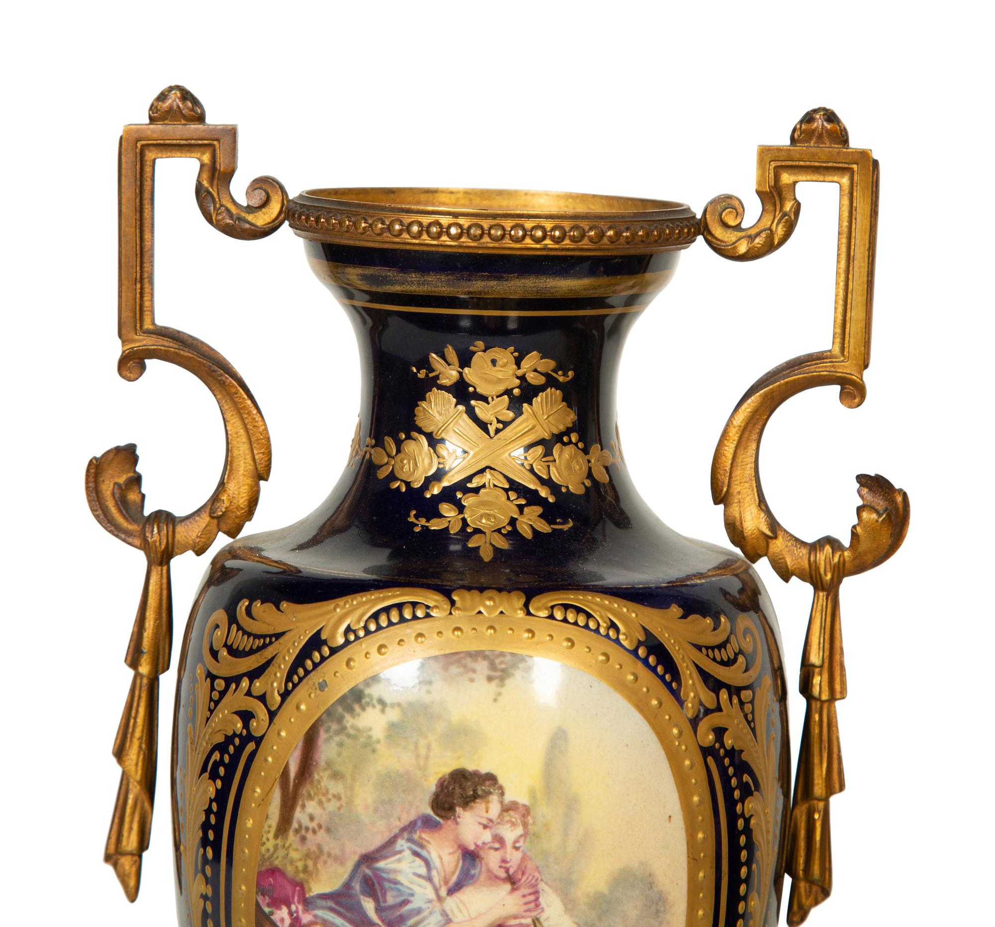 A Pair Gilt Metal Mounted Sèvres Style Porcelain Urns
