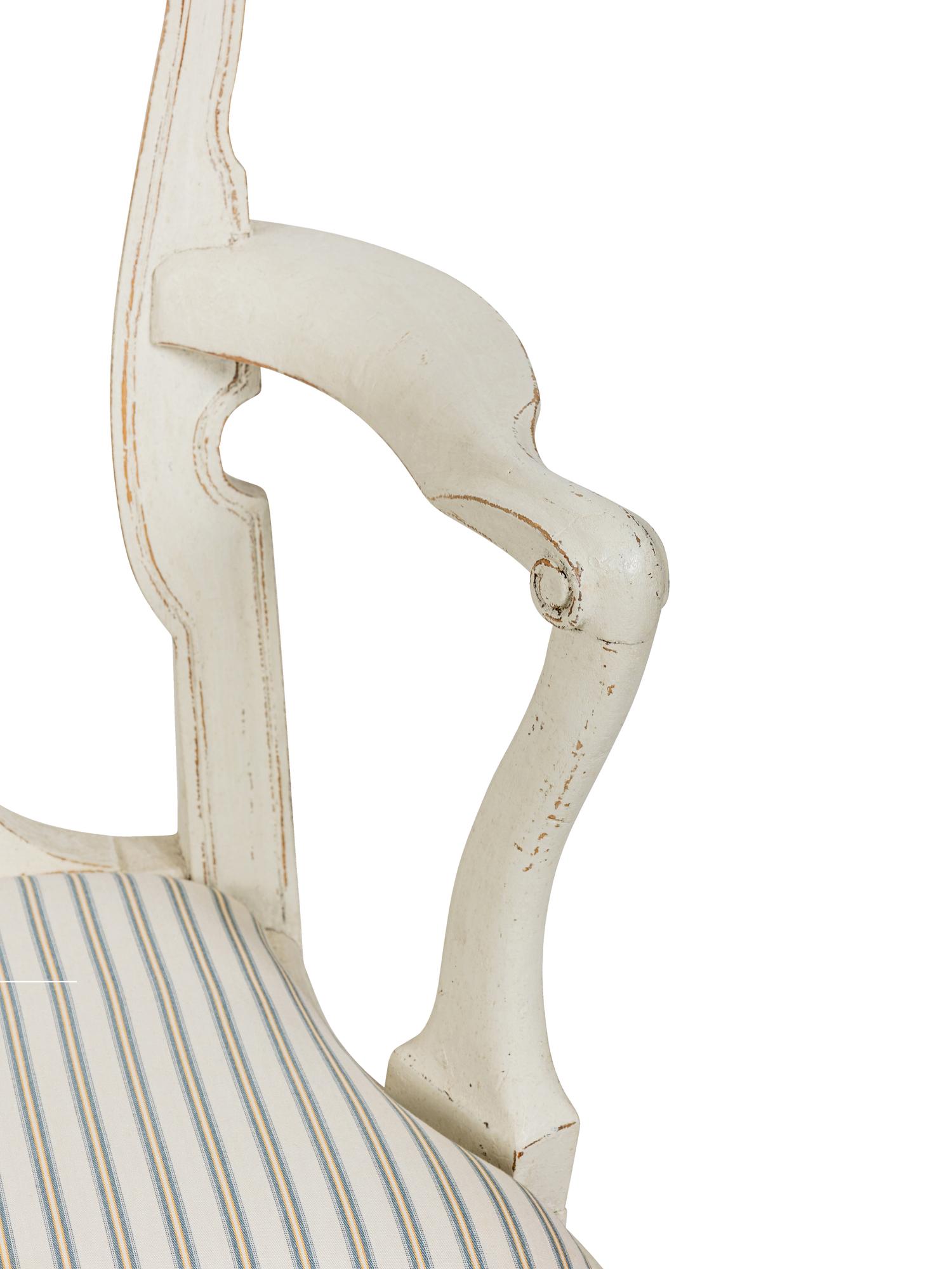 A Pair of Swedish White-Painted and Parcel-Gilt Open Armchairs