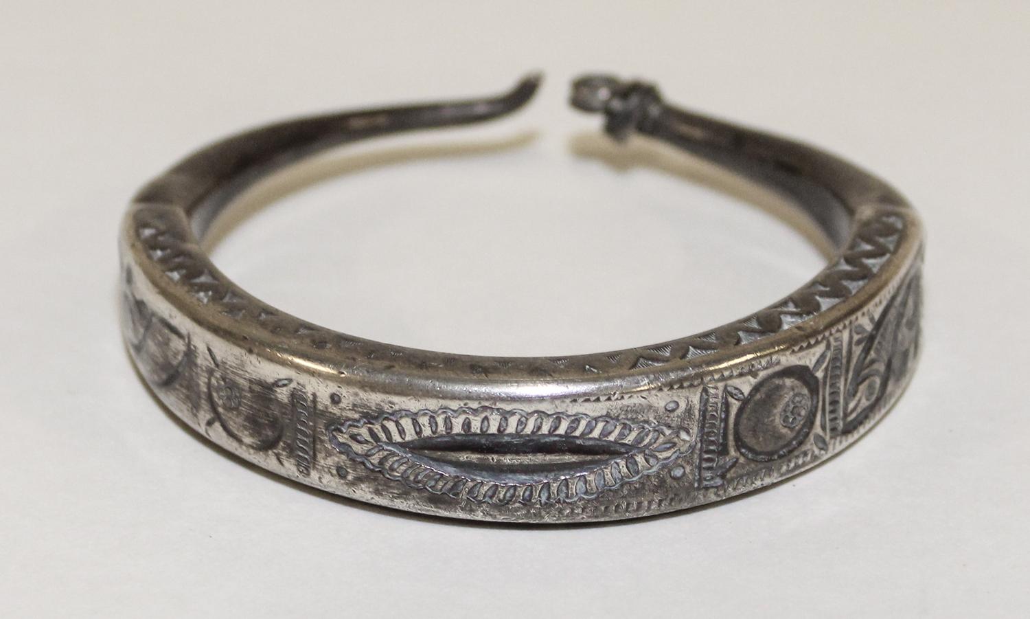 A Middle Eastern Silver Bangle Diameter of exterior 3 inches.