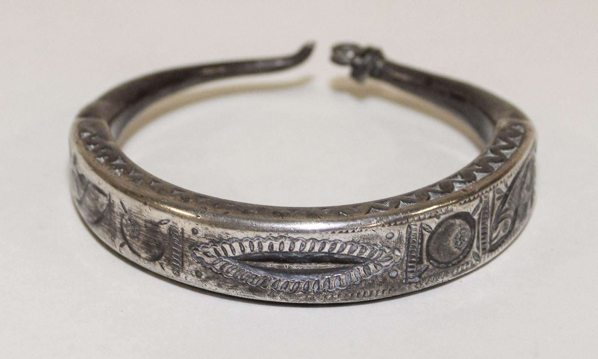 A Middle Eastern Silver Bangle Diameter of exterior 3 inches.