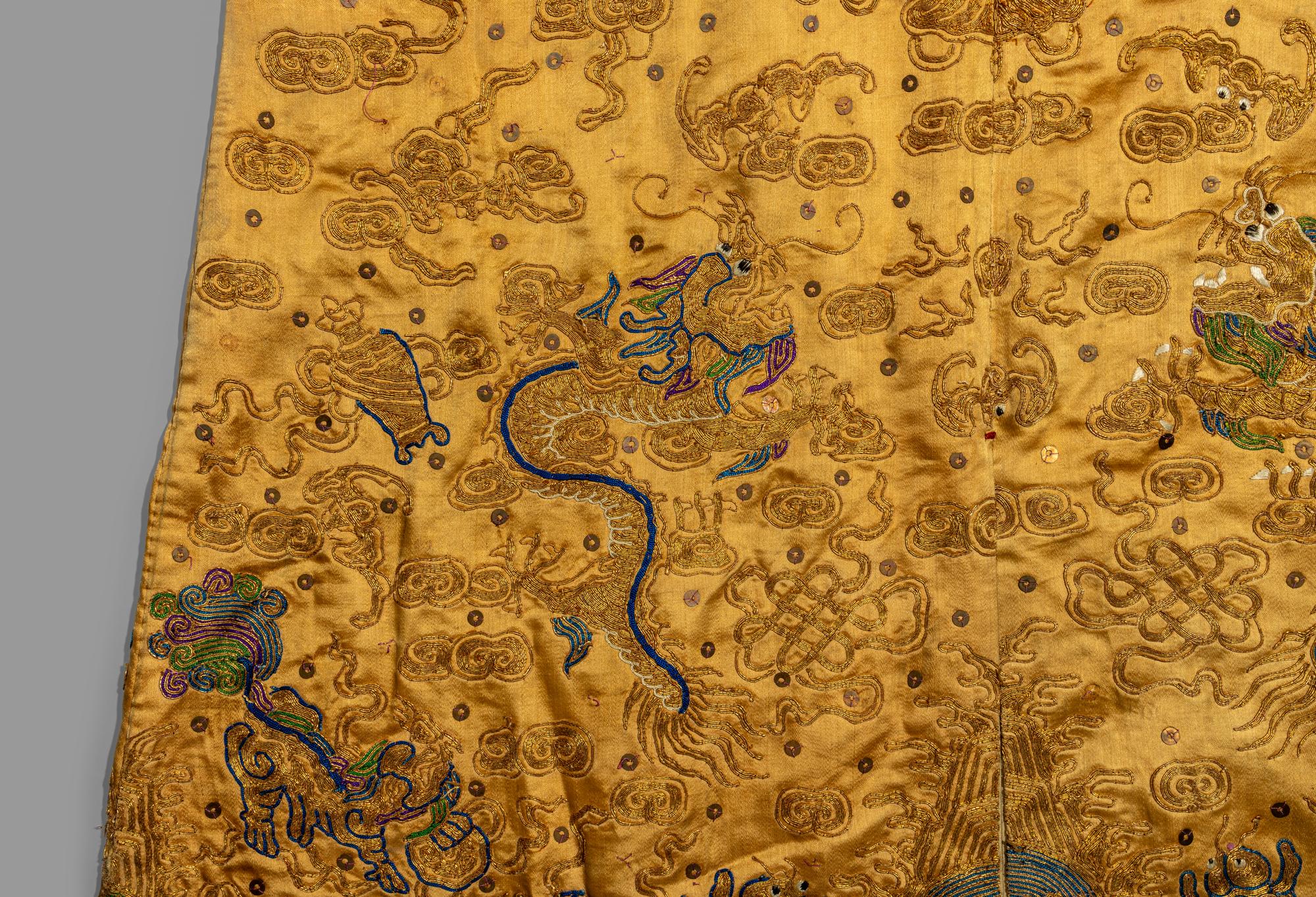 A Chinese Yellow Ground Embroidered Silk Dragon Robe