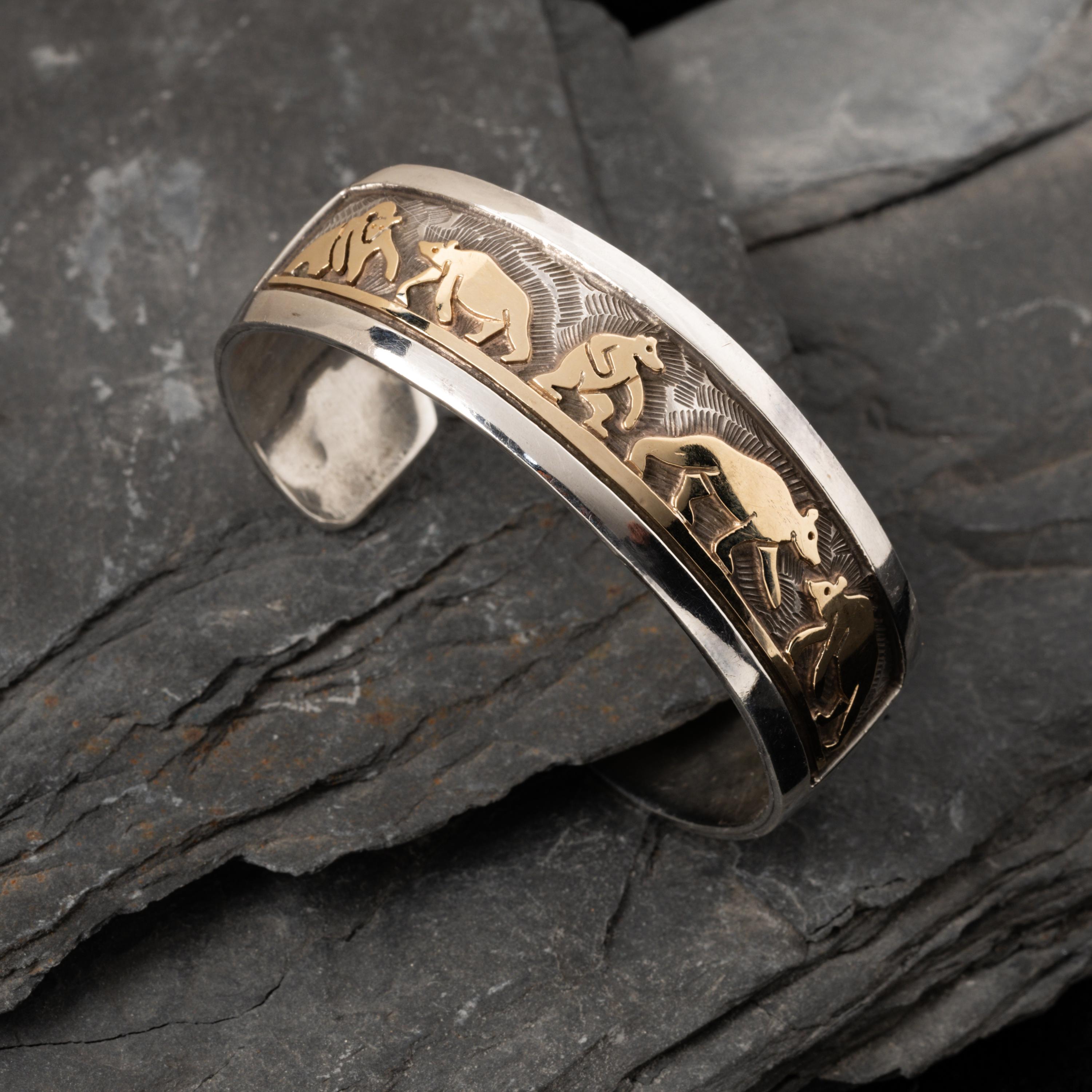Watson Honanie (Hopi, 1953-2023) — Sterling Silver with 14K Gold Overlay Cuff Bracelet, with Bear Scene
