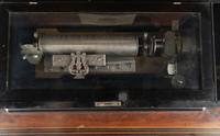 An Ideal Piccolo Music Box on Table by Mermod Frères