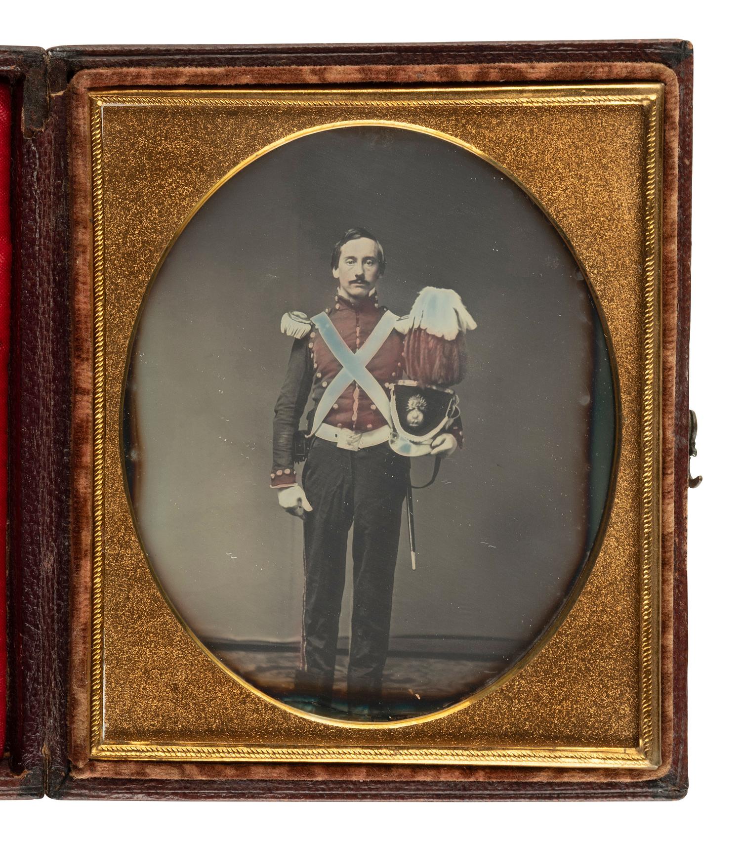 [MILITARIA]. [BRADY, M., photog.]. Sixth plate daguerreotype of a militiaman holding a plumed shako.