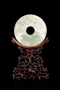 A Chinese Hardstone Bi Disk and Stand Diameter 6 1/2 inches. — LATE 19TH/EARLY 20TH CENTURY