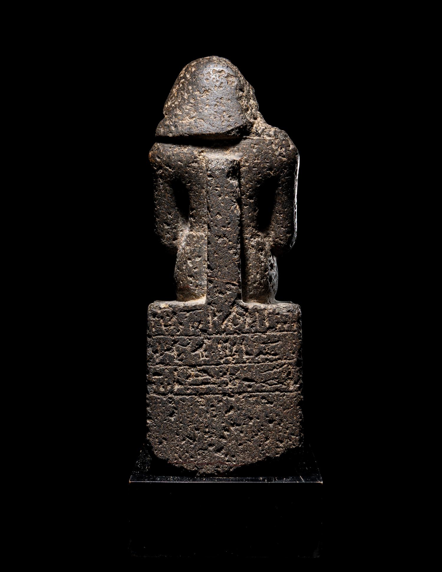 An Egyptian Diorite Seated Figure
