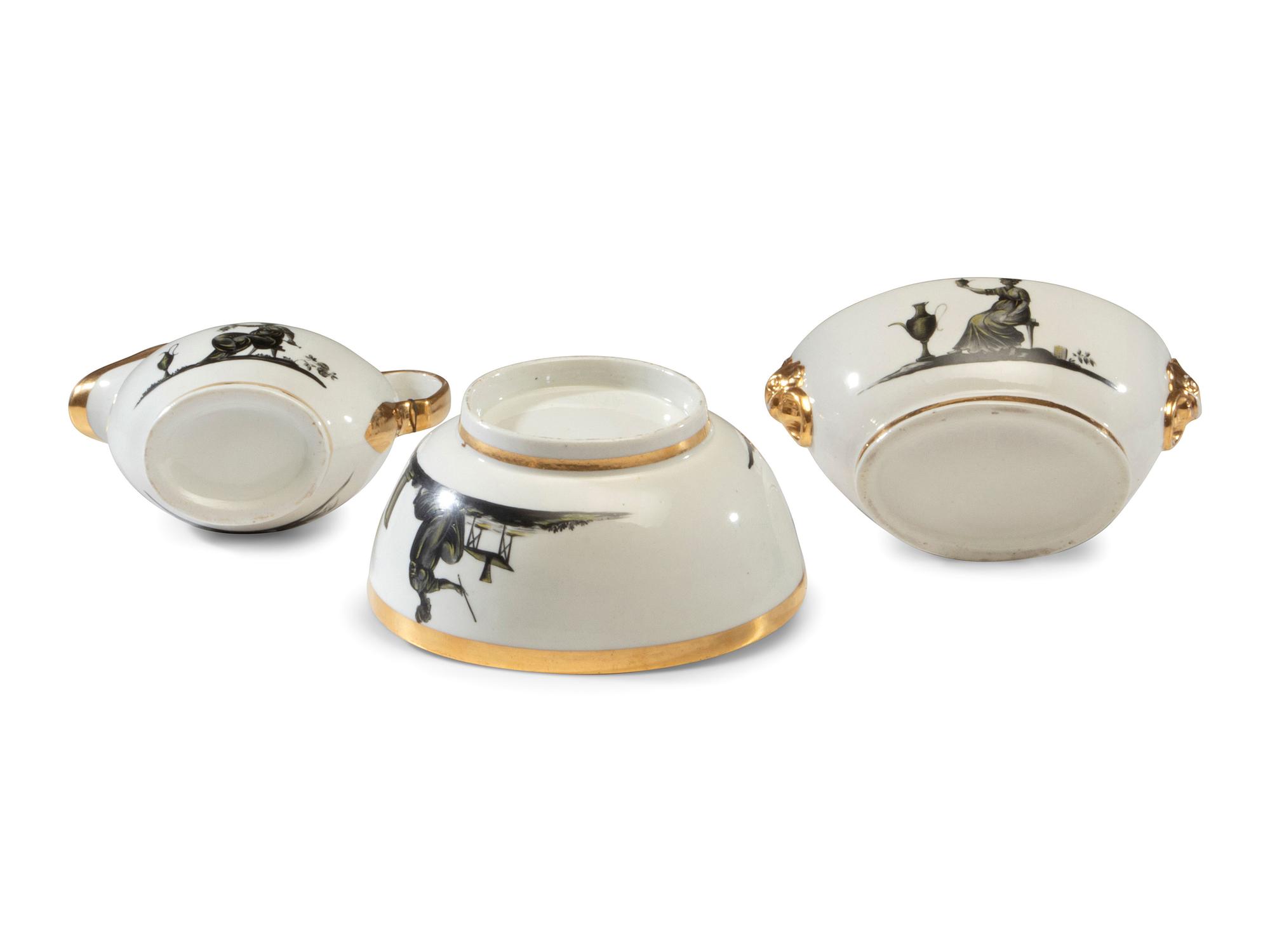 An English Porcelain Bat-Printed and Parcel Gilt Porcelain Tea Service