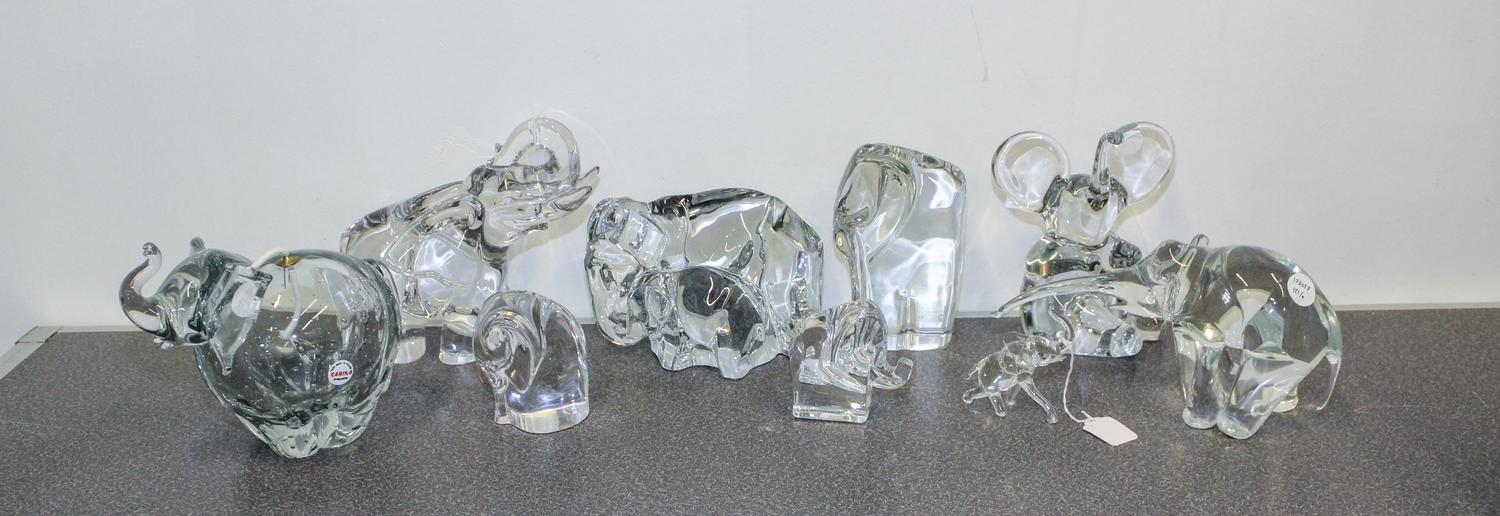 A Collection of Nine Glass Elephant Figures Height of tallest 8 1/2 inches.