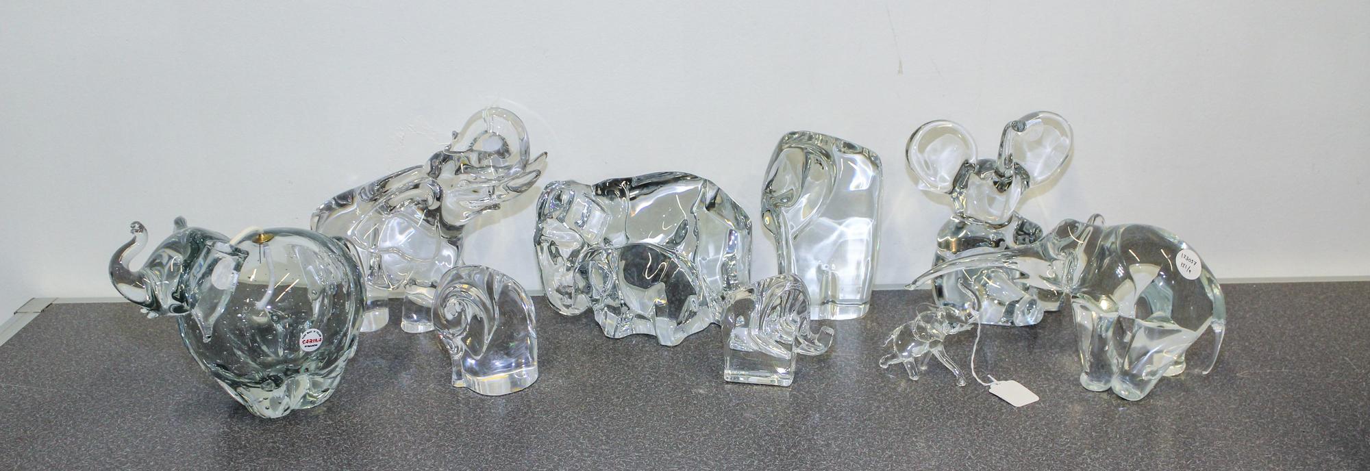 A Collection of Nine Glass Elephant Figures Height of tallest 8 1/2 inches.