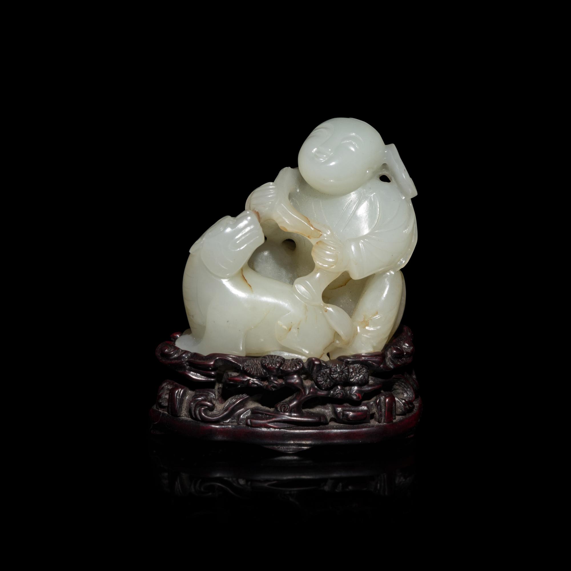 A Chinese White Jade Carving of Boy and Mythical Beast 白玉童子瑞獸把件