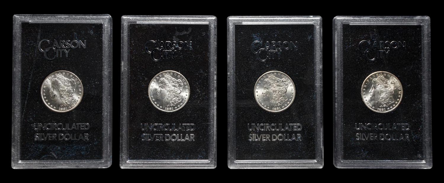 A Group of Four 1881-CC GSA: Morgan $1 Coins