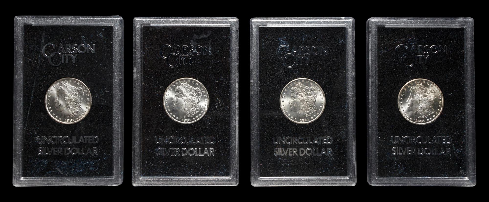 A Group of Four 1881-CC GSA: Morgan $1 Coins