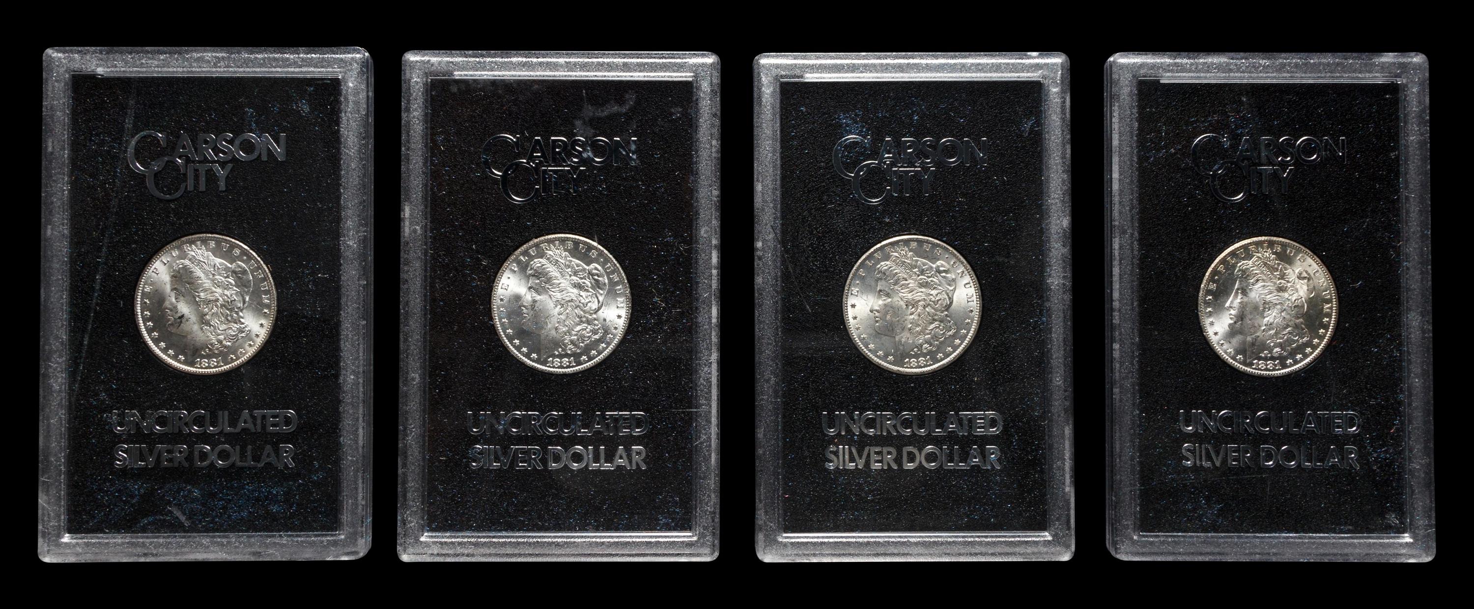A Group of Four 1881-CC GSA: Morgan $1 Coins