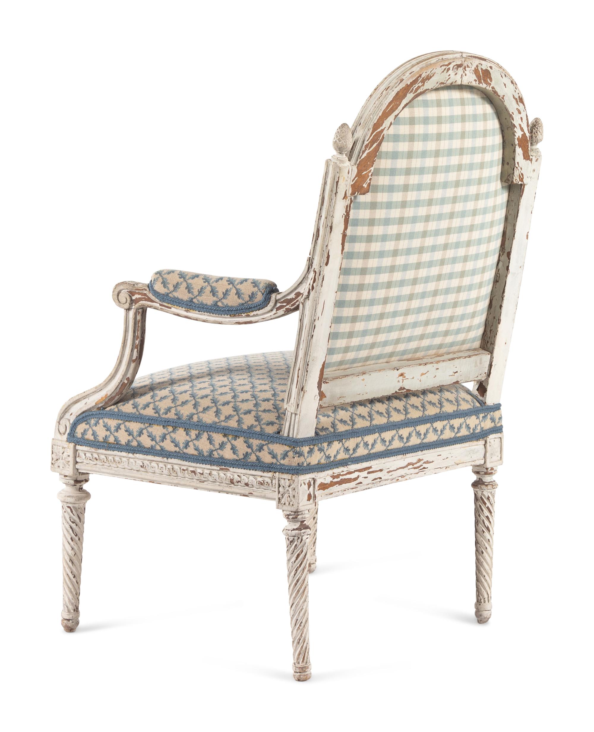 A Pair of Louis XVI Provincial White-Painted Fauteuils