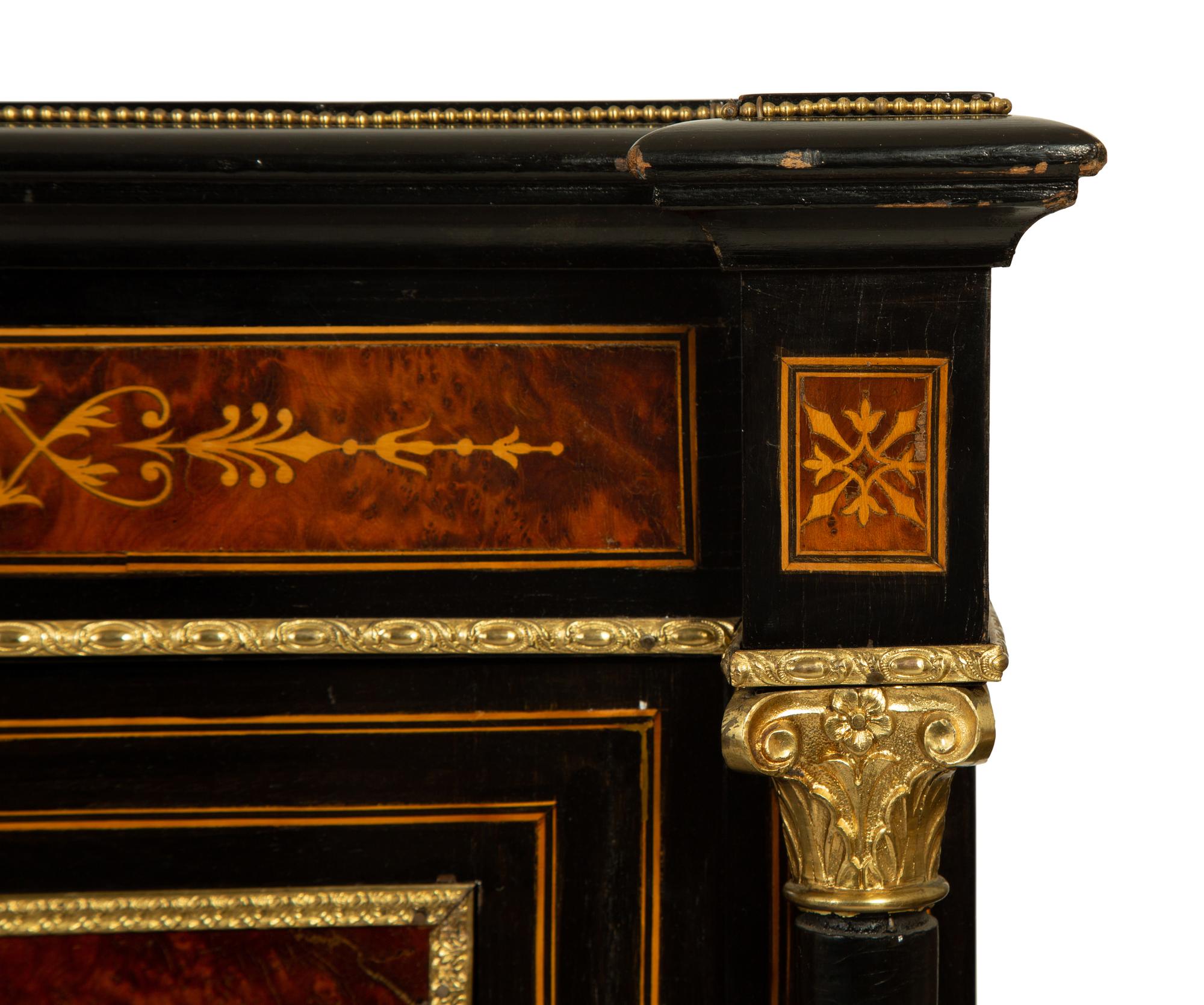 A Napoleon III Gilt Bronze Mounted Marquetry, Burlwood and Ebonized Wood Breakfront Cabinet — CIRCA 1870