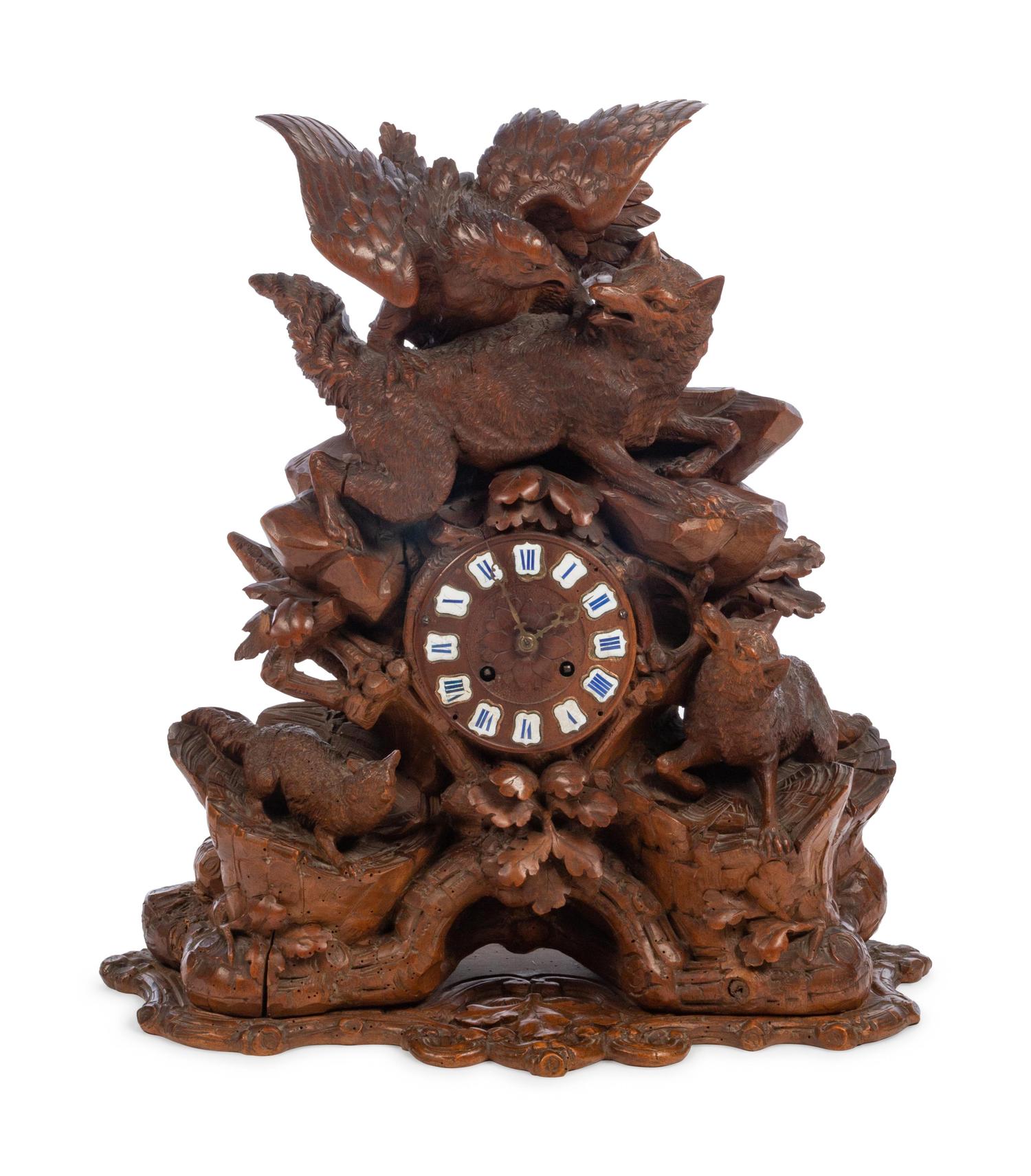 A Black Forest Carved Wood Mantel Clock