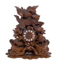 A Black Forest Carved Wood Mantel Clock