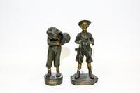 A Pair of Cast Metal Bronzes Height of tallest 13 inches.