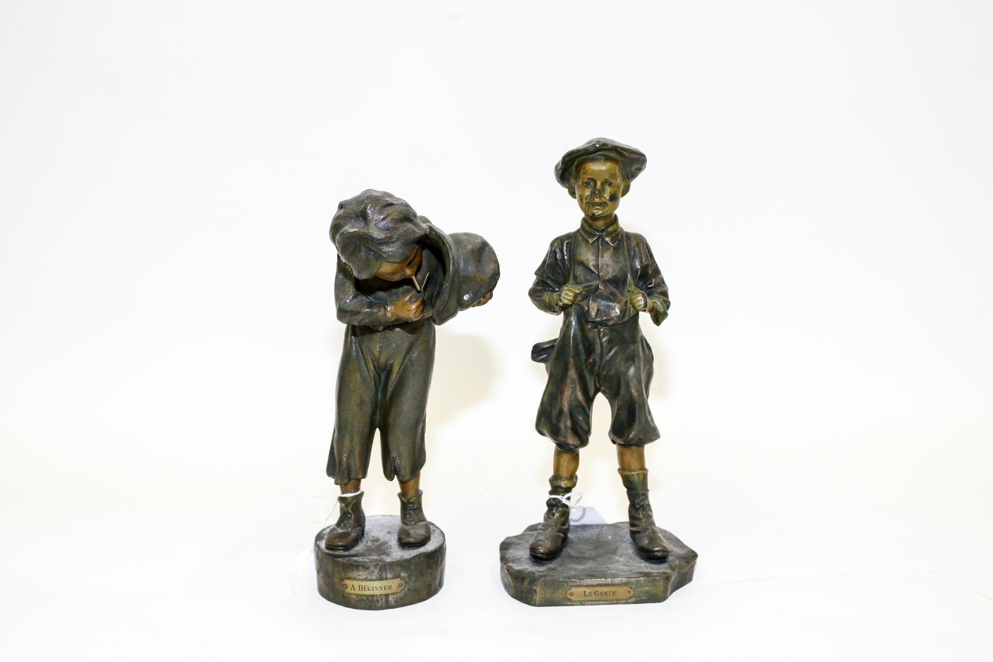 A Pair of Cast Metal Bronzes Height of tallest 13 inches.