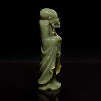 A Chinese carved celadon jade figure of a Lohan 青玉雕羅漢