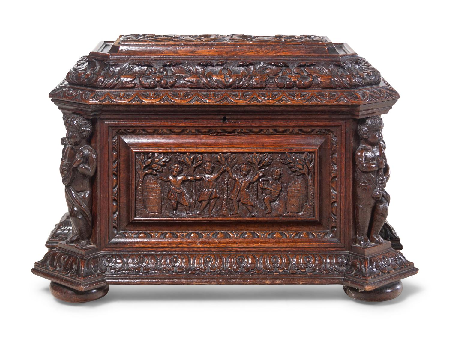 A Renaissance Revival Carved Oak Cellarette
