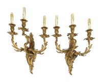 A Pair of Louis XV Style Gilt Bronze Three-Light Wall Sconces — 19TH/20TH CENTURY